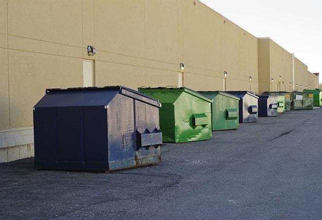 construction dumpsters on a worksite surrounded by caution tape in Lower Brule, SD